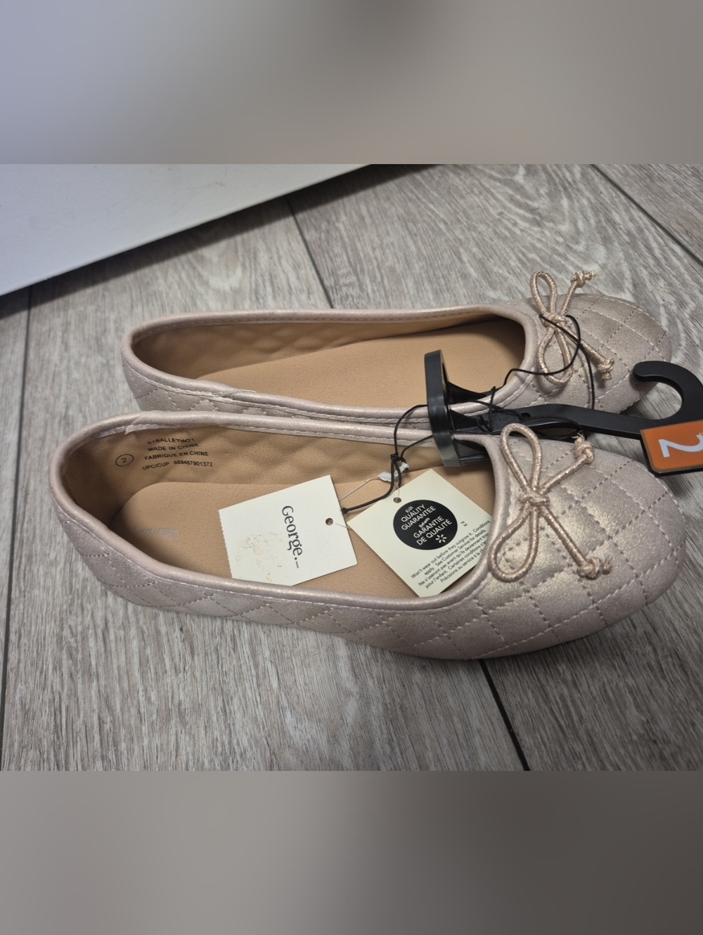 George Girl's quilted ballet flats with a bow detail and a subtle shimmer finish